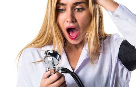 Doctor woman with blood pressure monitorの写真素材