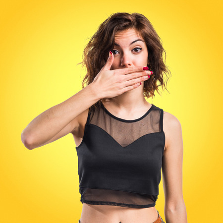 Woman covering her mouthの写真素材