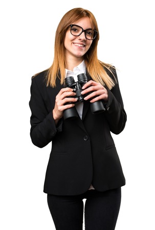 Young business woman with binocularsの写真素材