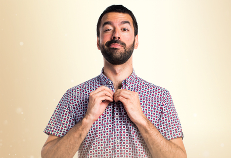 Handsome man on ocher backgroundの写真素材