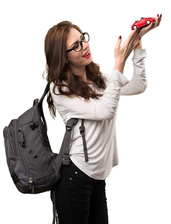 Student woman holding little car