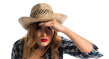 Sexy blonde woman cowgirl showing somethingの写真素材