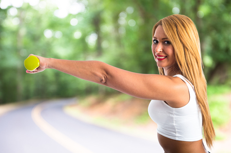 Sport woman doing weightliftingの写真素材