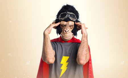Frustrated Superhero monkey man on ocher backgroundの写真素材
