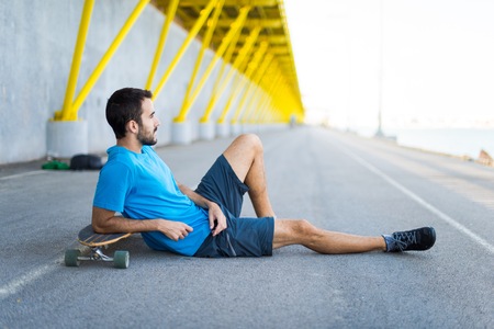 Skater resting in urban placeの写真素材