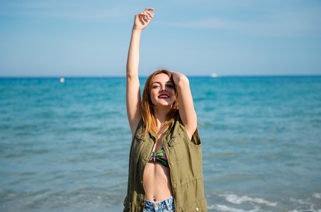 Beautiful young girl at the beachの写真素材