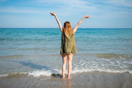 Beautiful young girl at the beach