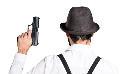 Hipster man with beard with a pistolの写真素材