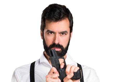Hipster man with beard with a pistol