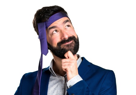Crazy and drunk businessman thinkingの写真素材