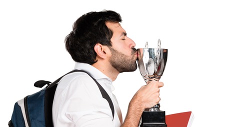 Student man holding a trophy