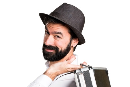 Hipster man with beard holding a briefcaseの写真素材