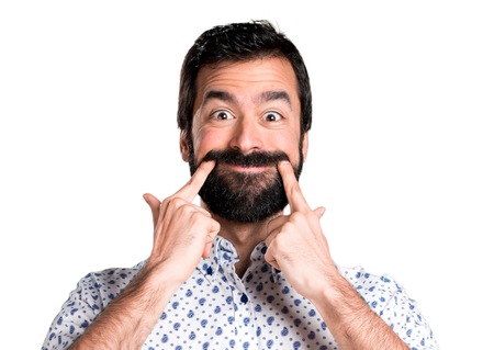 Happy handsome brunette man with beardの写真素材