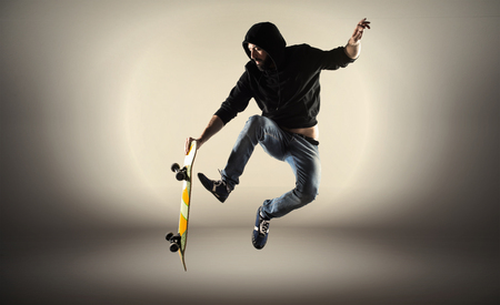 Man with skateboard jumpingの写真素材