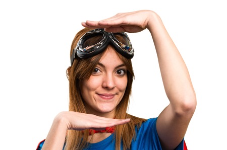 Pretty superhero girl focusing her faceの写真素材