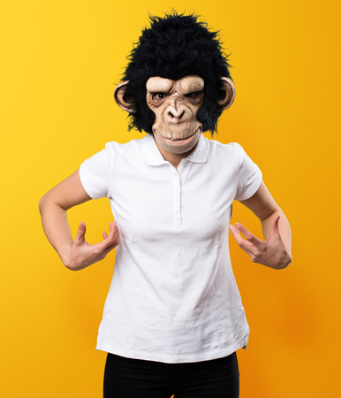 Monkey girl on yellow backgroundの写真素材