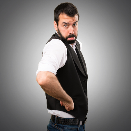 Sad cool man on grey backgroundの写真素材