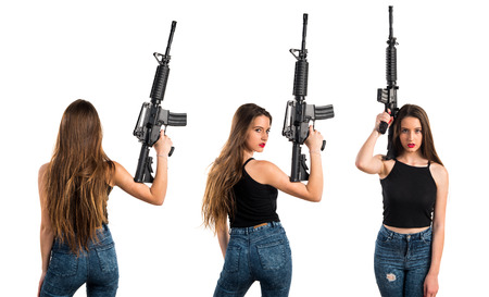 Young girl holding a rifle