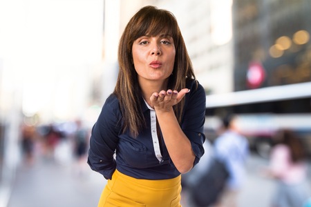 Woman sending a kissの写真素材