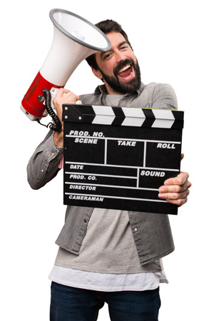 Handsome man with beard with cinema items on white backgroundの写真素材