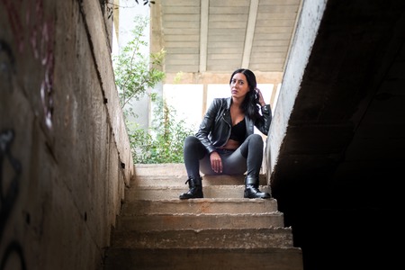 Pretty young woman inside building under constructionの写真素材