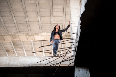 Pretty young woman inside building under constructionの写真素材