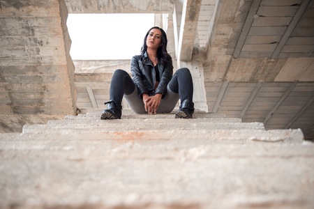 Pretty young woman inside building under constructionの写真素材