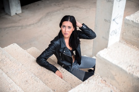 Pretty young woman inside building under constructionの写真素材