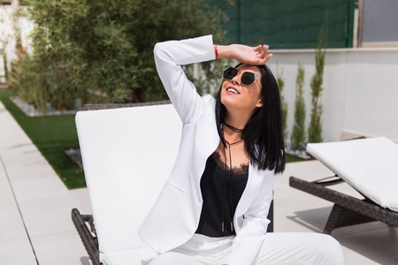 Beautiful young girl posing on the terraceの写真素材