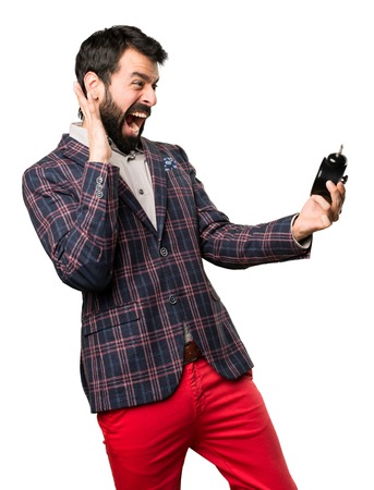 Well dressed man holding vintage clock on white backgroundの写真素材