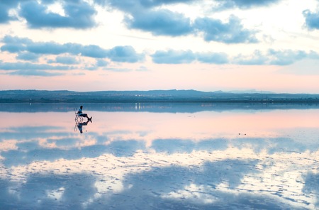 Beautiful blue lake in the sunsetの写真素材