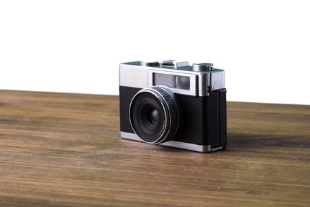 camera over isolated white background on tableの写真素材