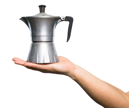 Hand holding Coffee pot over isolated white backgroundの写真素材