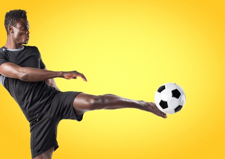 Black man playing footballの写真素材