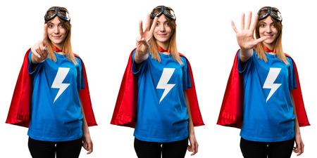 Pretty superhero girl counting one, three and fiveの写真素材