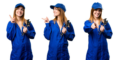 Set of Delivery woman pointing to the lateral, front and upの写真素材