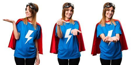 Pretty superhero girl holding somethingの写真素材