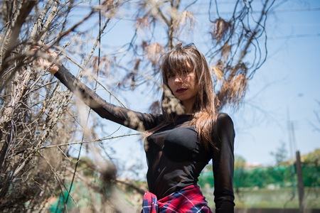 Beautiful young girl in a park in an abandoned park