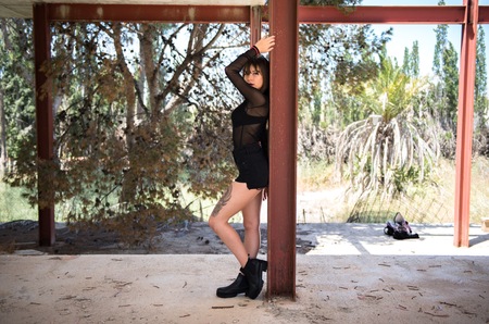 Beautiful young girl in an abandoned buildingの写真素材