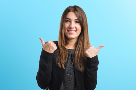 Girl with thumb upの写真素材