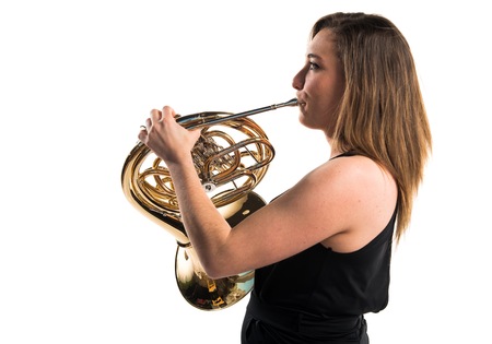 Girl playing the french hornの写真素材