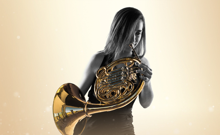 Girl playing the french hornの写真素材