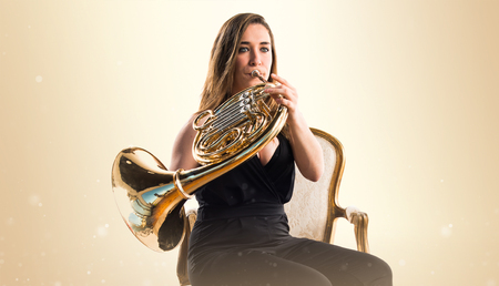 Girl playing the french hornの写真素材