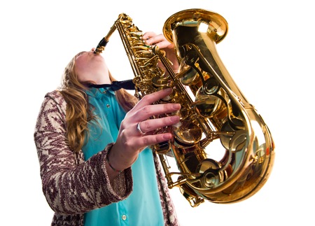 Girl playing the saxophoneの写真素材