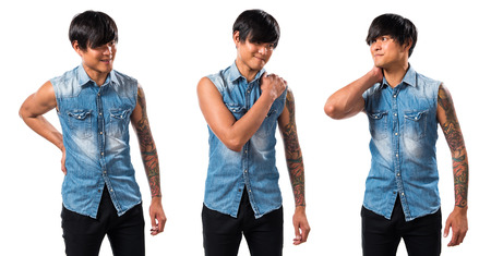 Asian handsome man with shoulder painの写真素材