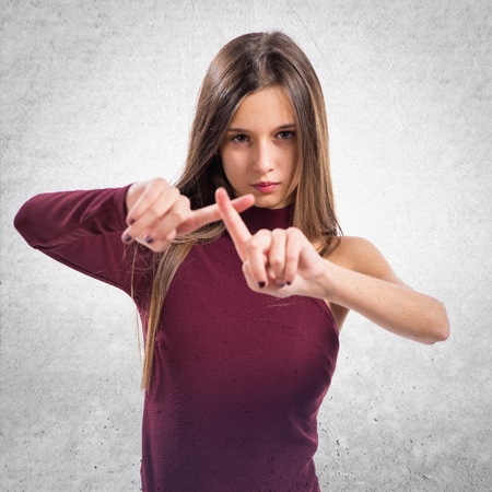 Young teenager girl making NO gestureの写真素材