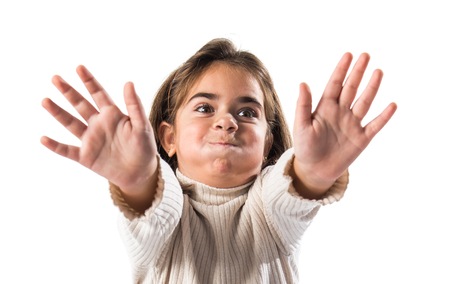 Little brunette girl making stop signの写真素材