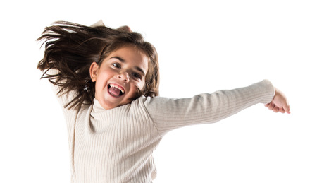 Little brunette girl jumpingの写真素材