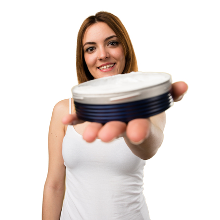 Happy beautiful young girl with moisturizerの写真素材