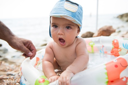 Cute baby at the beachの写真素材